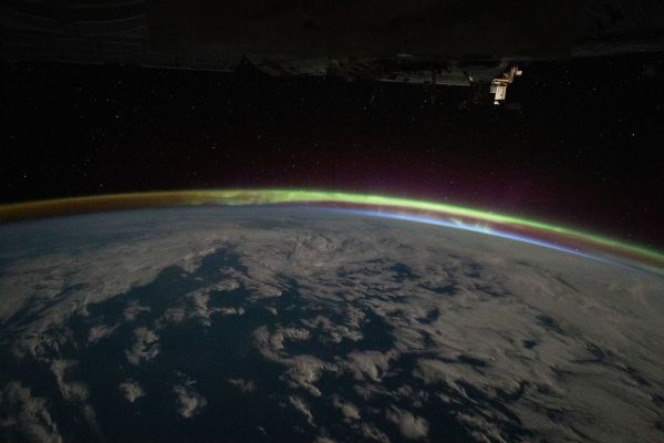 The aurora australis intersects Earth's atmospheric glow