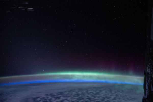 The Earth's glow mingles with the 'aurora australis'