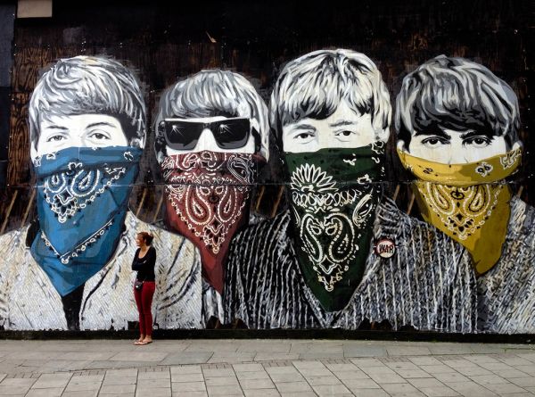 Girl in Front of Beatles Mural