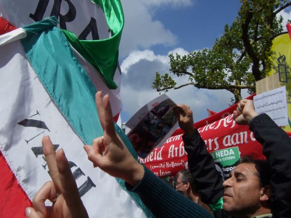 Waving flags and shouting slogans.