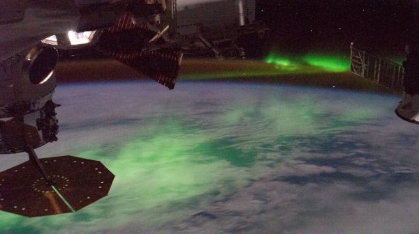 The 'aurora australis' glows beneath the International Space Station
