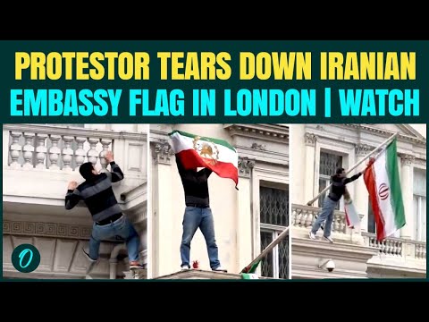 Iran Protest Breaking: UK Protester Tears Down Iranian Flag Outside Iranian Embassy in London |VIDEO